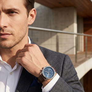 Professional man wearing Hugo Boss Trace 1514002 with blue dial and silver case leather strap water resistant 50m