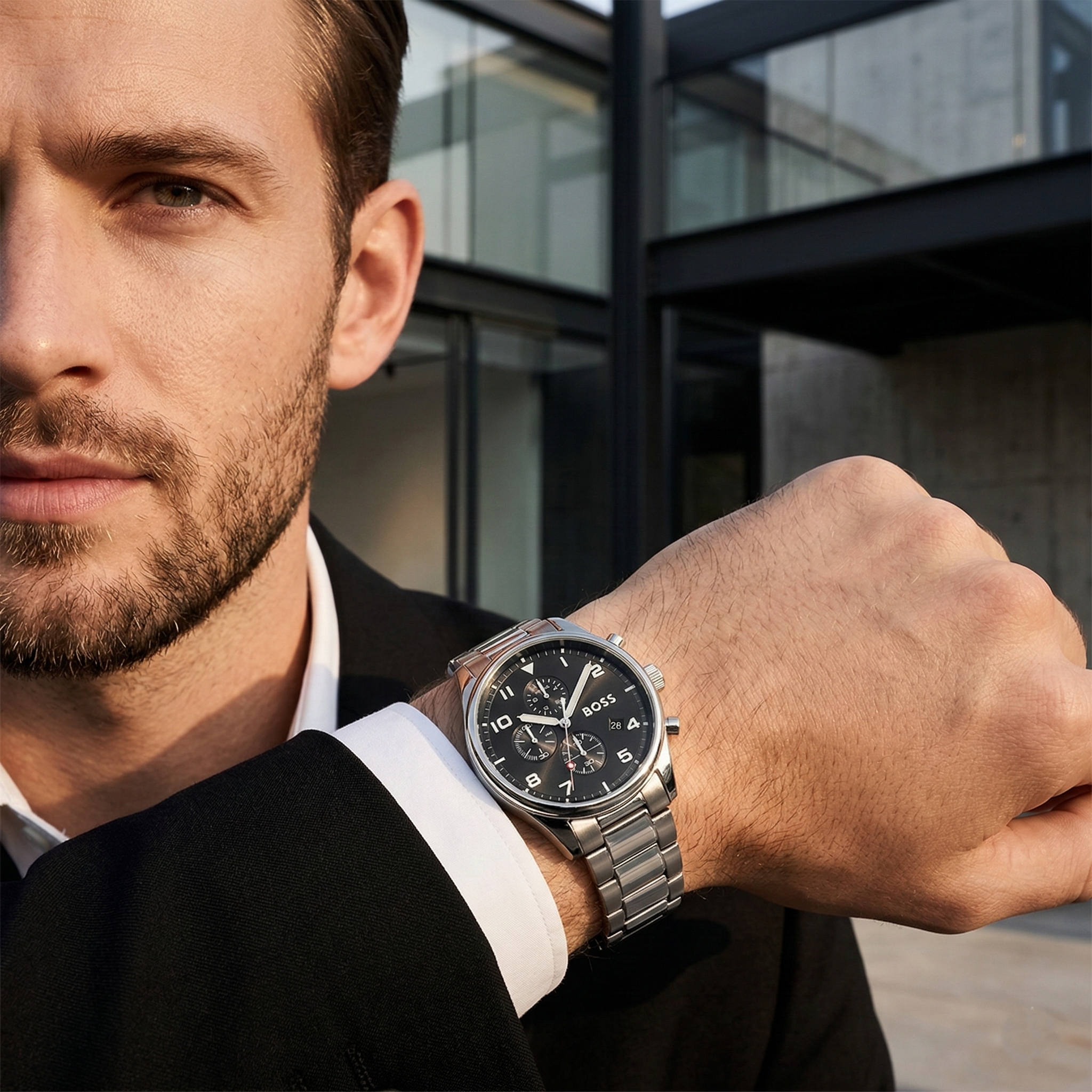 Professional man wearing Hugo Boss View 1514008 with black dial and silver metal link strap water resistant 50m