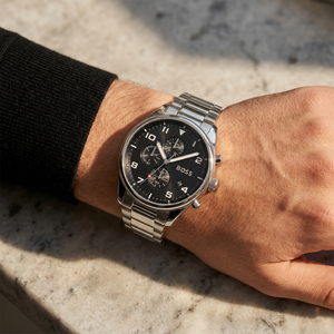 Close up of Hugo Boss View 1514008 on wrist showing black dial and silver metal link strap with 50m water resistance