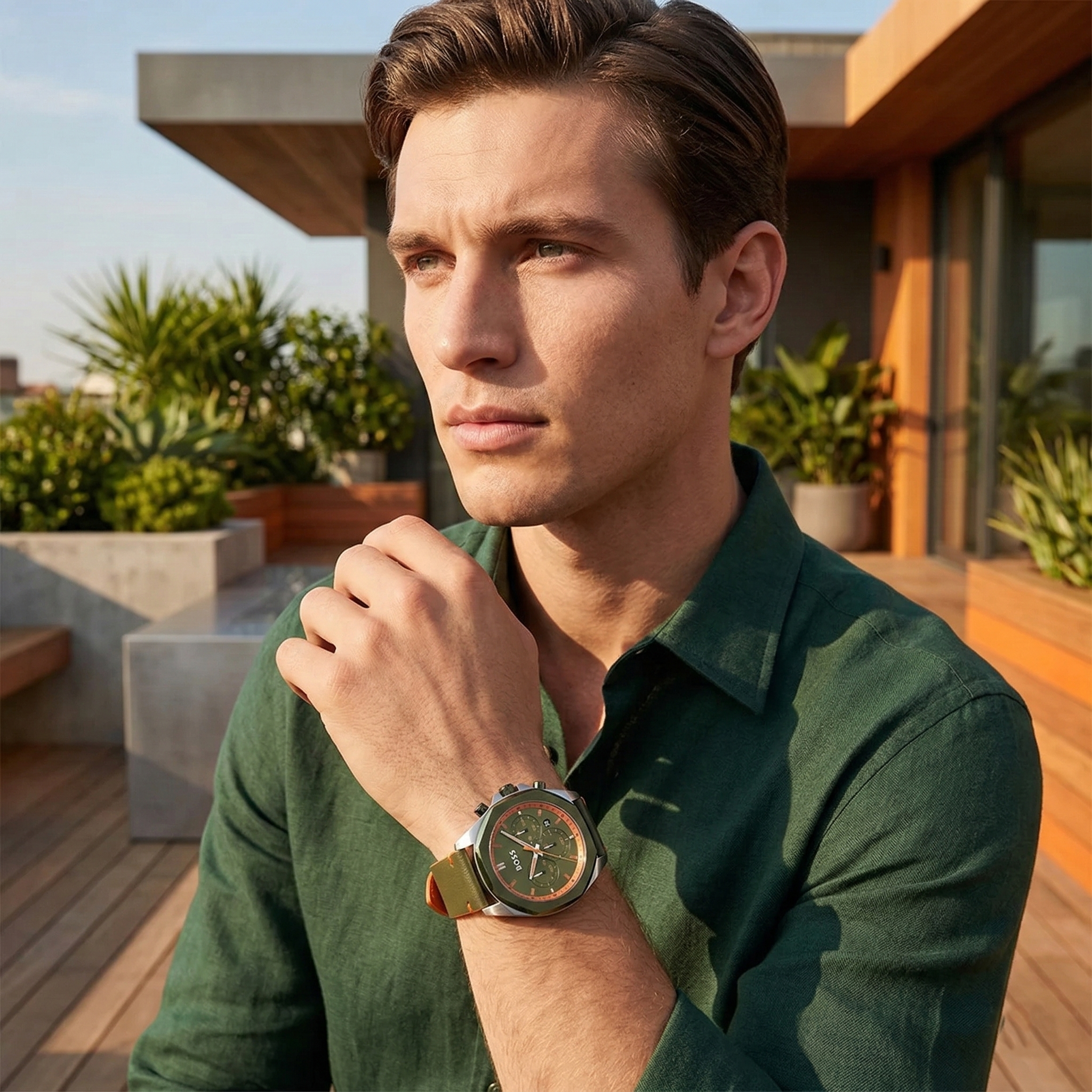 Professional man wearing Hugo Boss Cloud 1514018 with green dial and green leather strap water resistant 50m