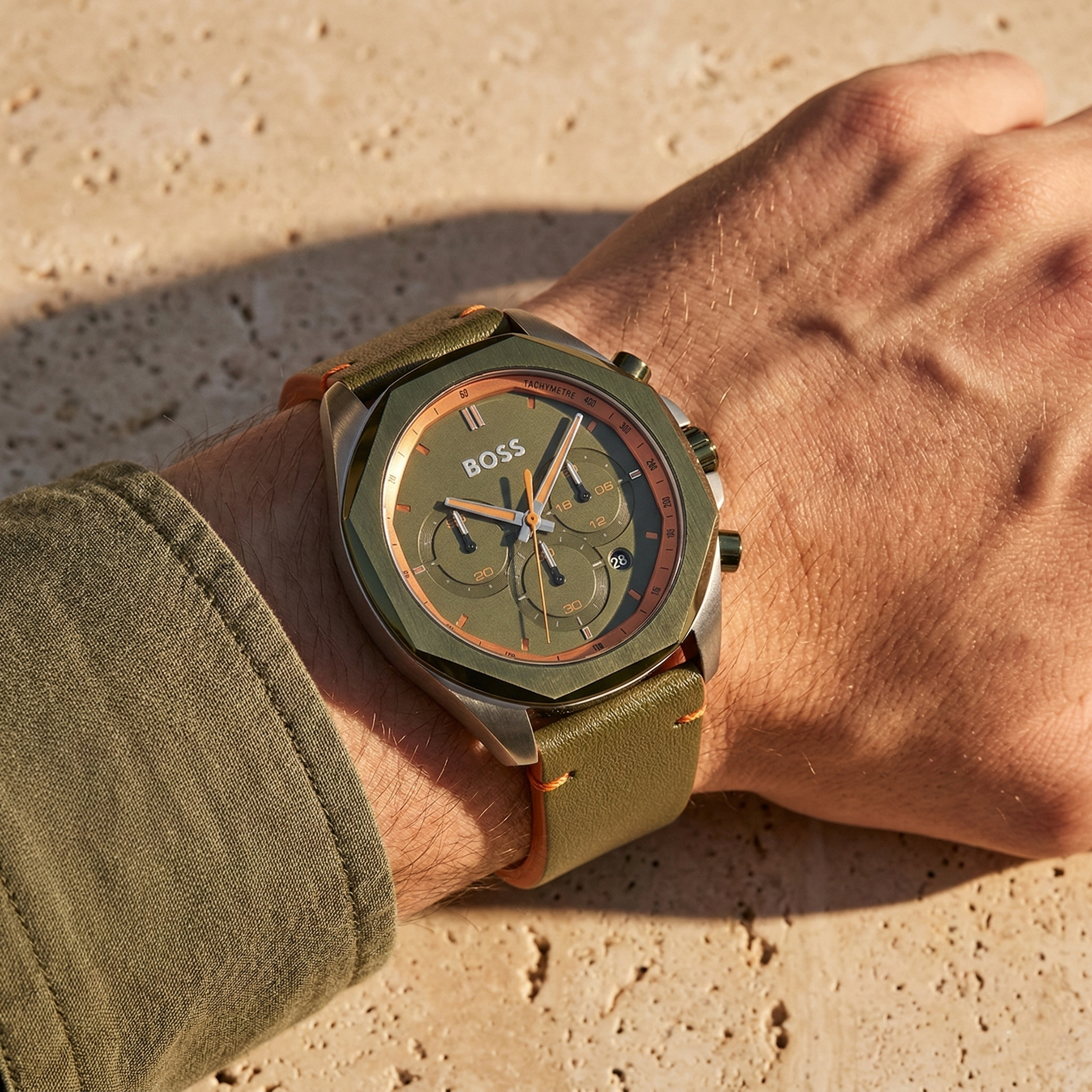 Close up of Hugo Boss Cloud 1514018 on wrist showing green dial and green leather strap with 50m water resistance