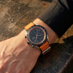 Close up of Hugo Boss Centre Court 1514025 on wrist showing black dial and orange rubber strap with 50m water resistance