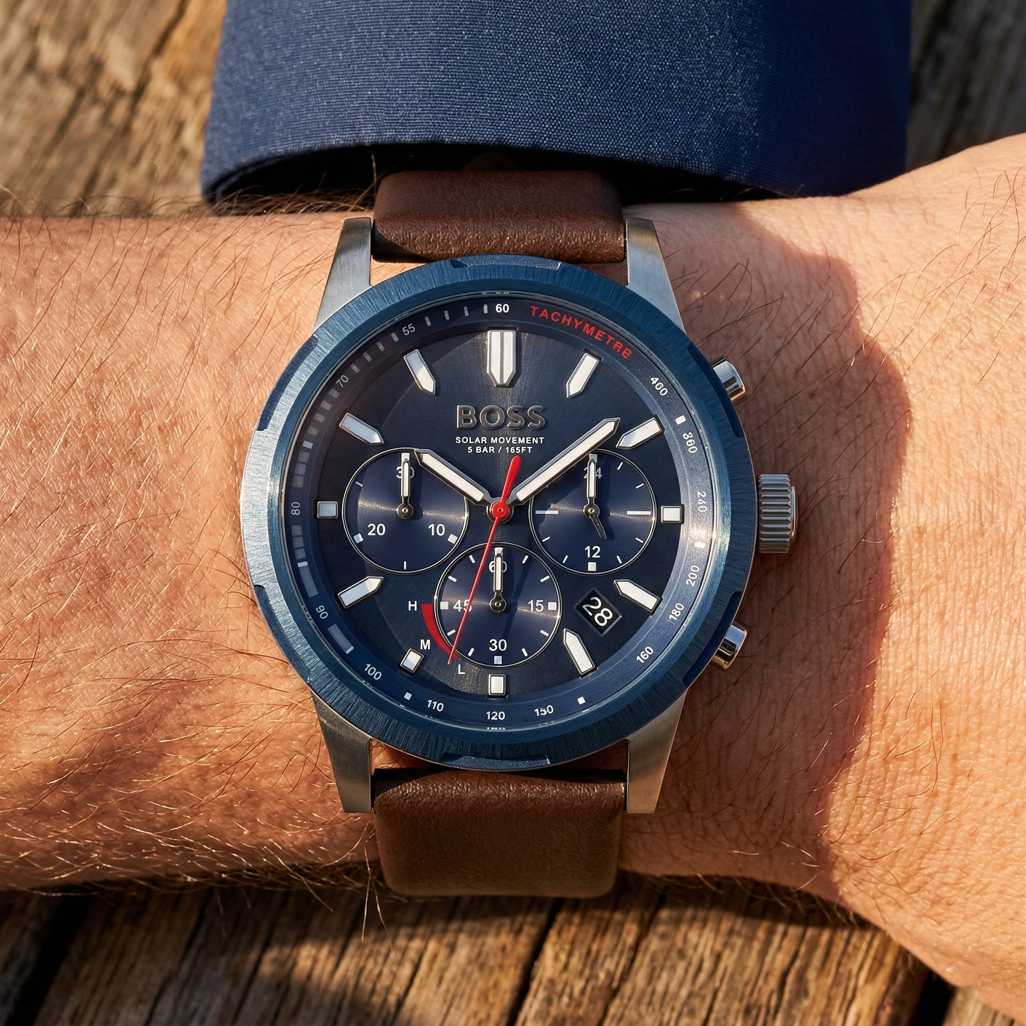 Close up of Hugo Boss Solgrade 1514030 on wrist showing solar blue dial and brown leather strap with 50m water resistance