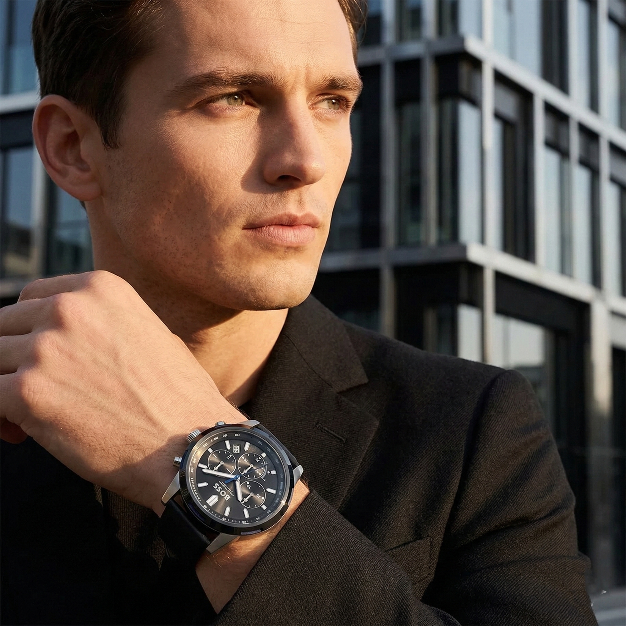 Professional man wearing Hugo Boss Solgrade 1514031 solar-powered watch with black dial and black leather strap 50m water resistant