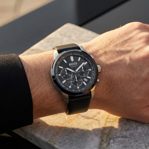 Close up of Hugo Boss Solgrade 1514031 on wrist showing solar black dial and black leather strap with 50m water resistance