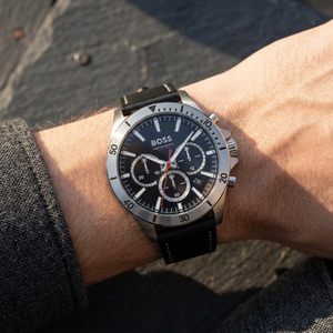 Close up of Hugo Boss Troper 1514055 on wrist showing black sunray dial and leather strap with 50m water resistance