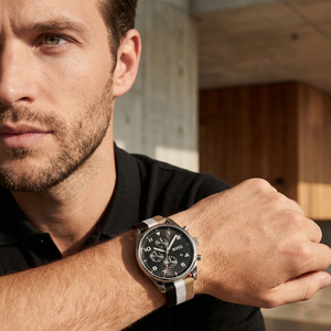 Professional man wearing Hugo Boss View 1514062 with black dial and multicolored textile strap water resistant 50m