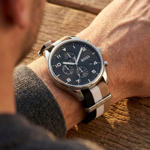 Close up of Hugo Boss View 1514062 on wrist showing black dial and multicolored textile strap with 50m water resistance