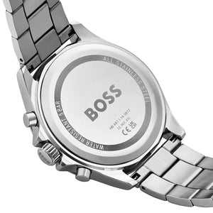Close-up of a silver Hugo Boss watch with metal band on a white background
