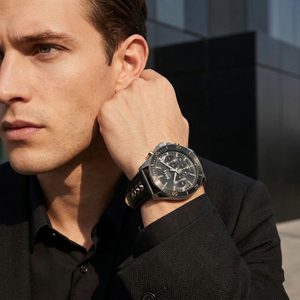 Professional man wearing Hugo Boss Troper 1514121 with black dial and black leather strap water resistant 50m