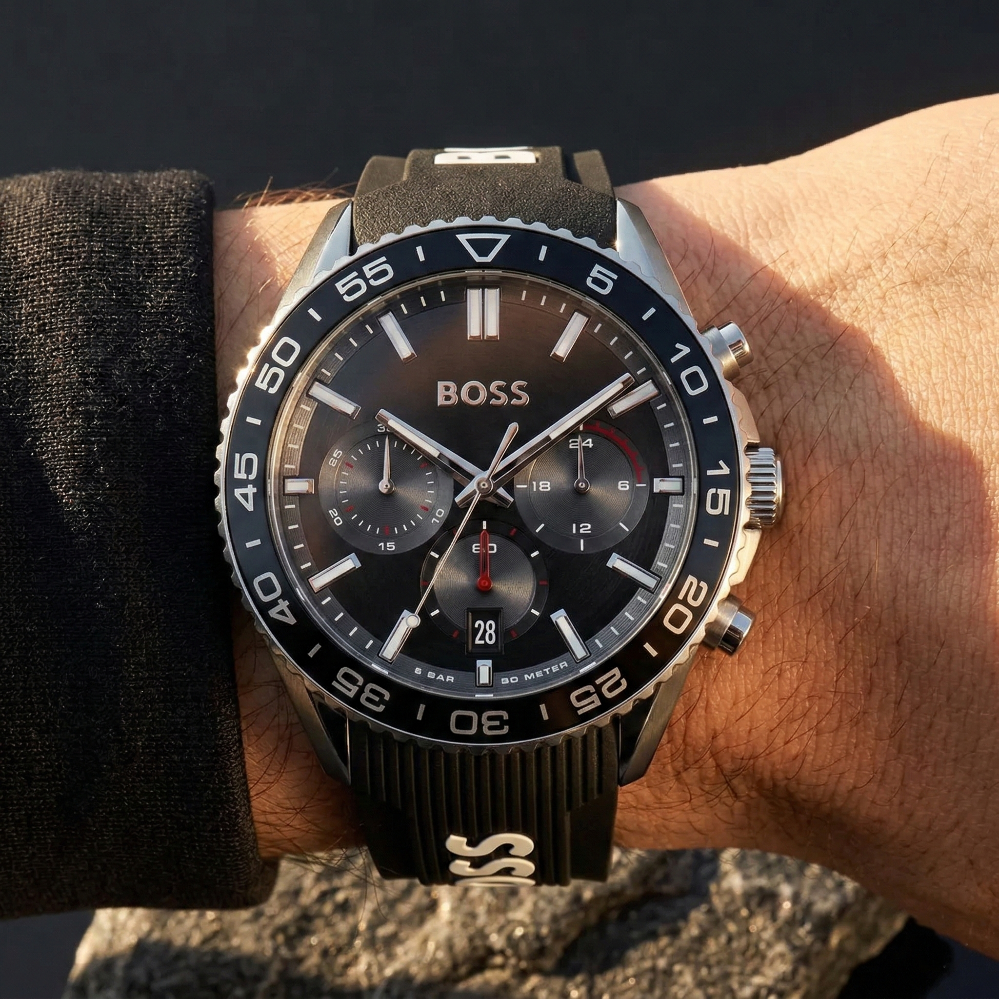 Close up of Hugo Boss Runner 1514141 on wrist showing black dial and black rubber strap with 50m water resistance