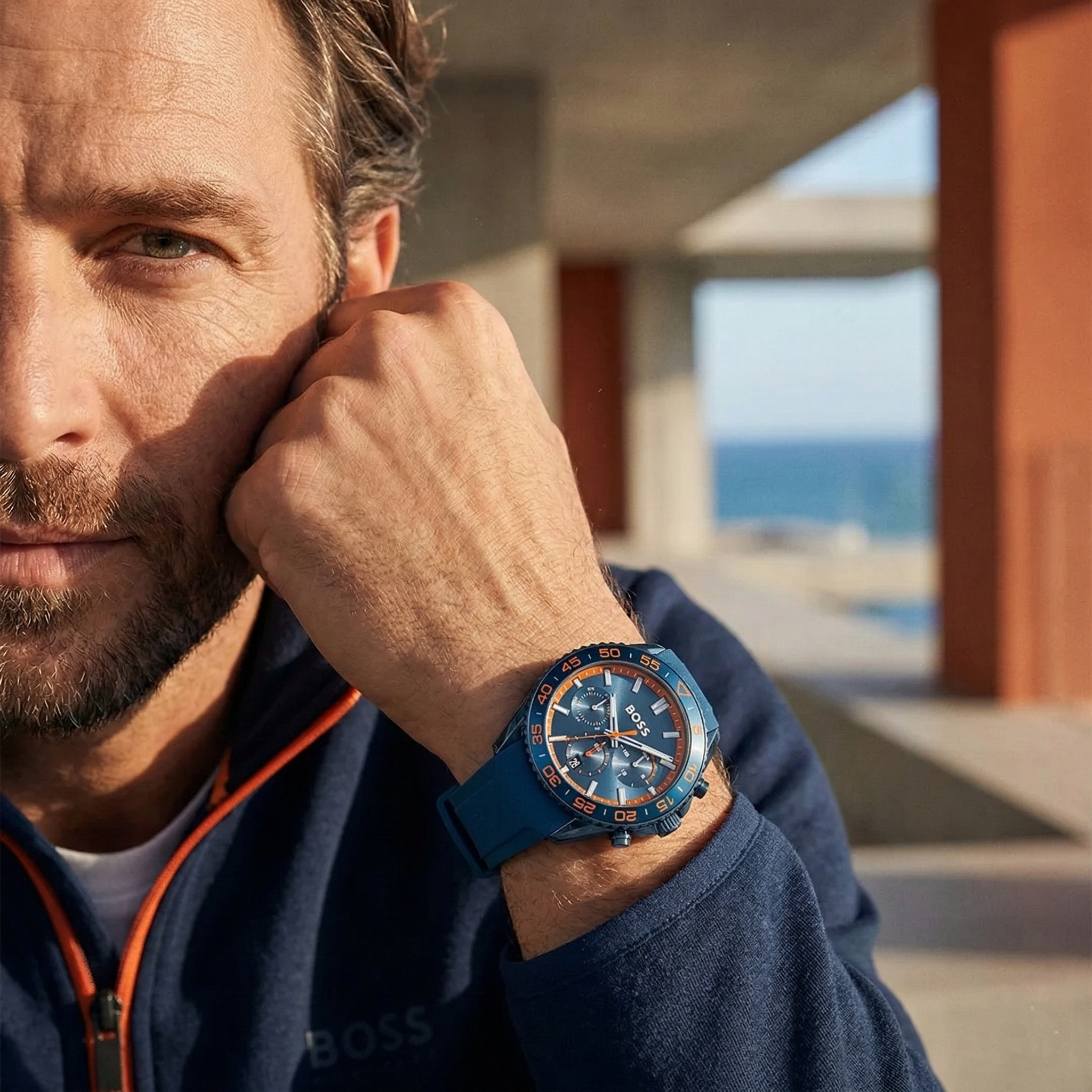 Sporty man wearing Hugo Boss Volane 1514142 with blue dial and blue rubber strap water resistant 50m