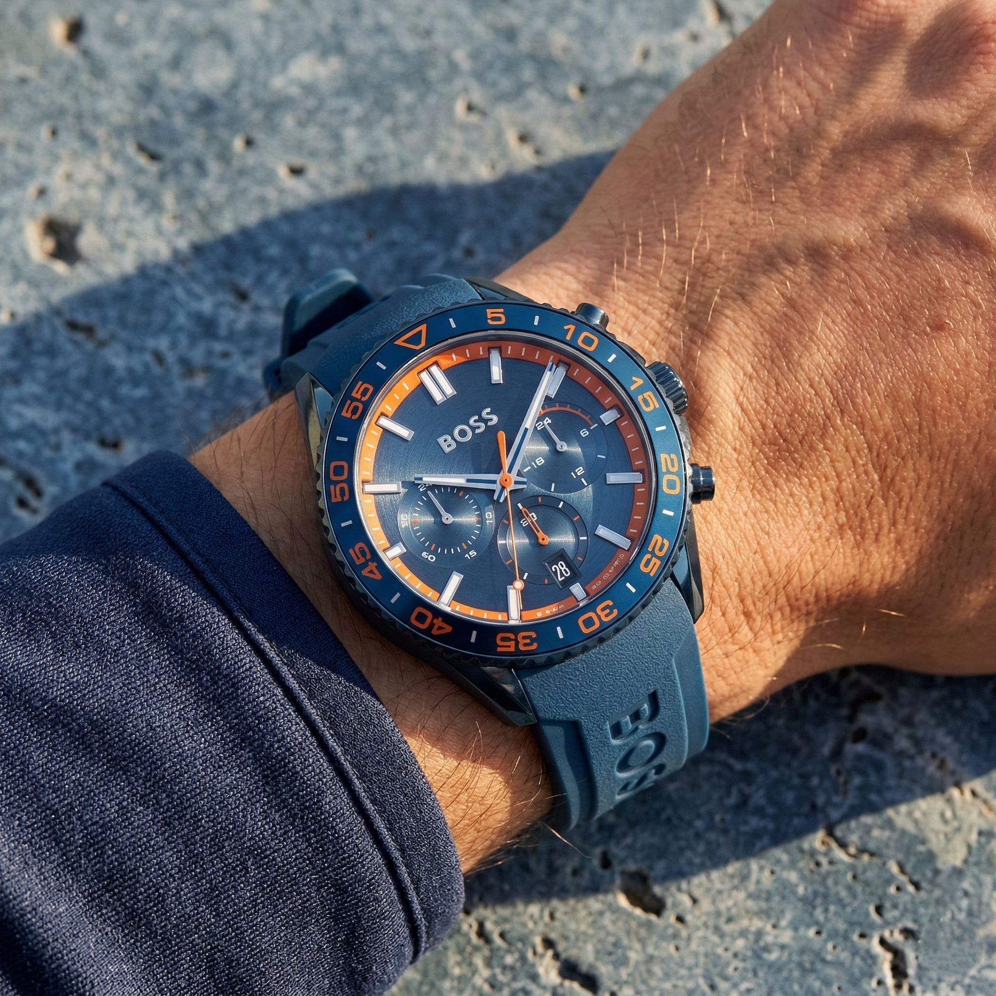 Close up of Hugo Boss Volane 1514142 on wrist showing blue dial and blue rubber strap with 50m water resistance