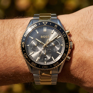 Close up shot of Boss Runner 1514144 on wrist showing the two-tone case and black tachymeter bezel