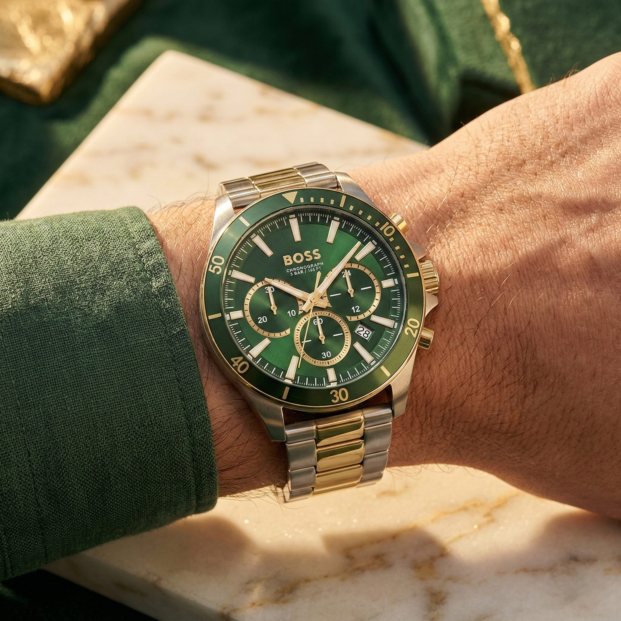 Close up of Hugo Boss Runner 1514154 on wrist showing green dial and two-tone metal strap with 50m water resistance