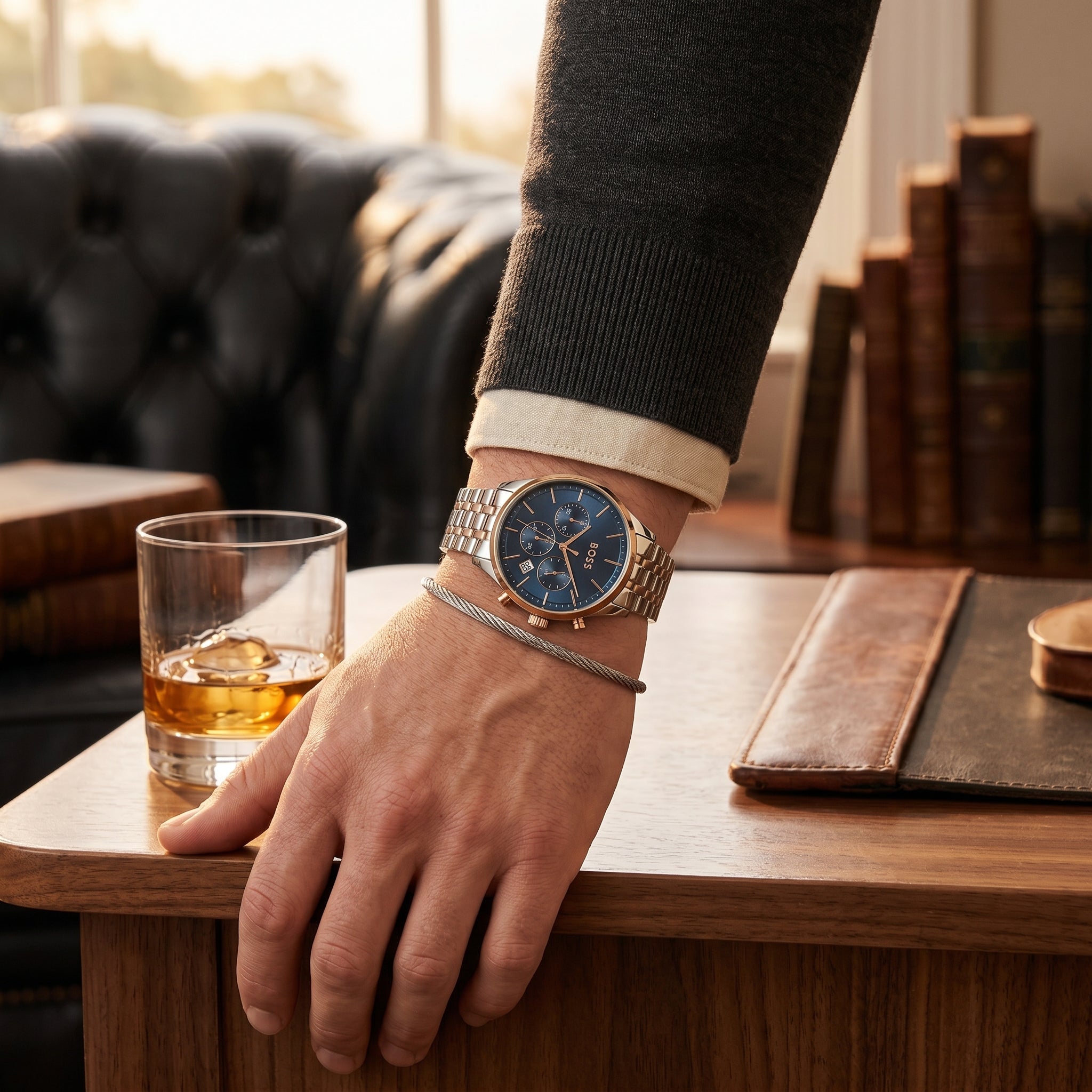 Lifestyle photo of Boss Avery 1514158 showing the bold silver watch on a man's wrist in a professional setting from Luxury Hub Store