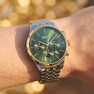 Close up shot of Boss Avery 1514159 on wrist showing the polished silver case and green sunray dial texture from Luxury Hub Store