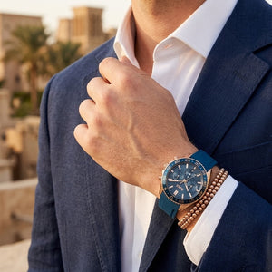 Lifestyle photo of Hugo Boss 1514169 showing the sporty blue rubber watch on a man's wrist
