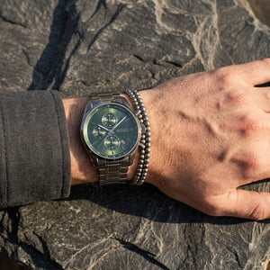 Close up shot of Hugo Boss 1514228 on wrist showing green sunray dial and chronograph sub-dials