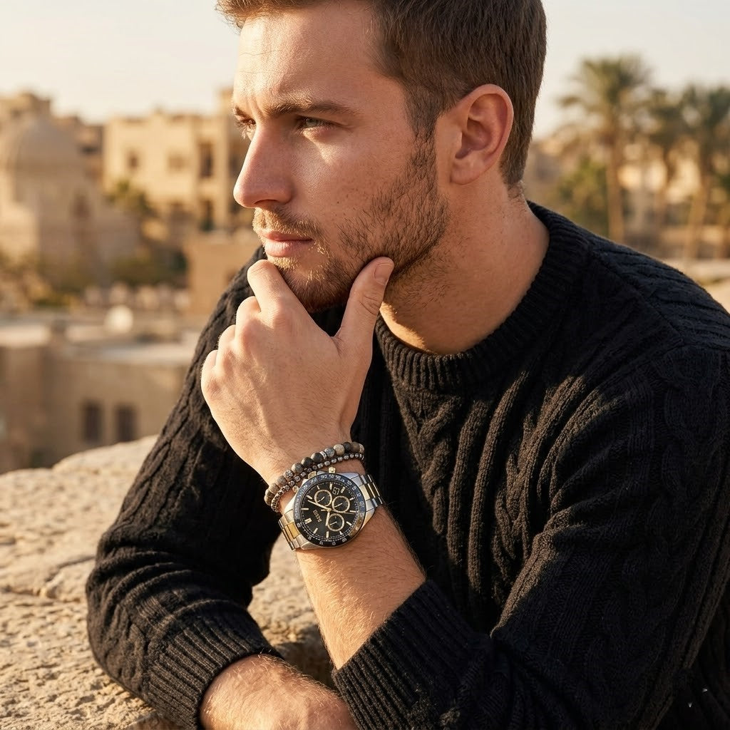 Elegant man wearing Hugo Boss Hero 1514269 men's quartz battery watch with two-tone case and luxury racing black dial