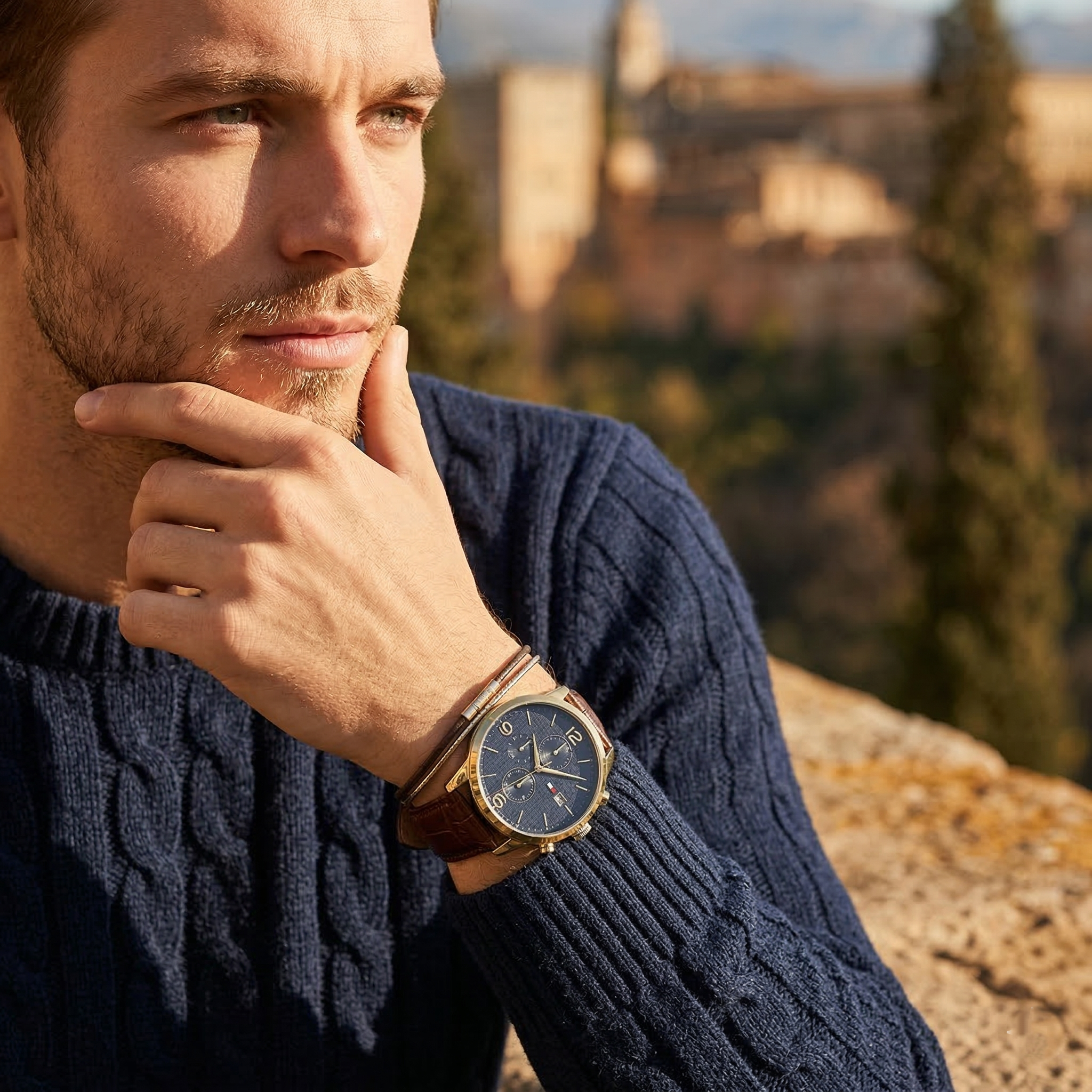 Close up of Tommy Hilfiger Liam 1710359 men's quartz battery watch on wrist showing blue textured dial and brown leather strap