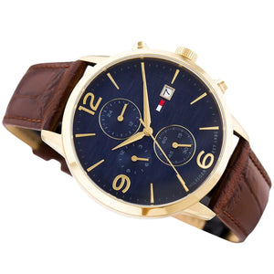 Left angled view of Tommy Hilfiger Liam 1710359 men's quartz battery watch showing brown leather strap and gold-tone case profile