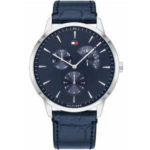 Tommy Hilfiger Brad 1710387 men's watch featuring a 44mm silver-tone case, navy blue dial, and navy blue genuine leather strap.