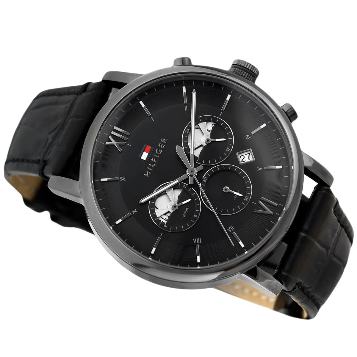 Angled profile right view of Tommy Hilfiger Evan Men's 1710395 watch showing polished round silver stainless steel case plain smooth bezel protective crown detailed integrated protected area and textured rich black genuine calfskin leather strap with white contrast stitching dynamic visually casual utility visual dynamic visual style visual dynamic visual utility dynamic casual utility