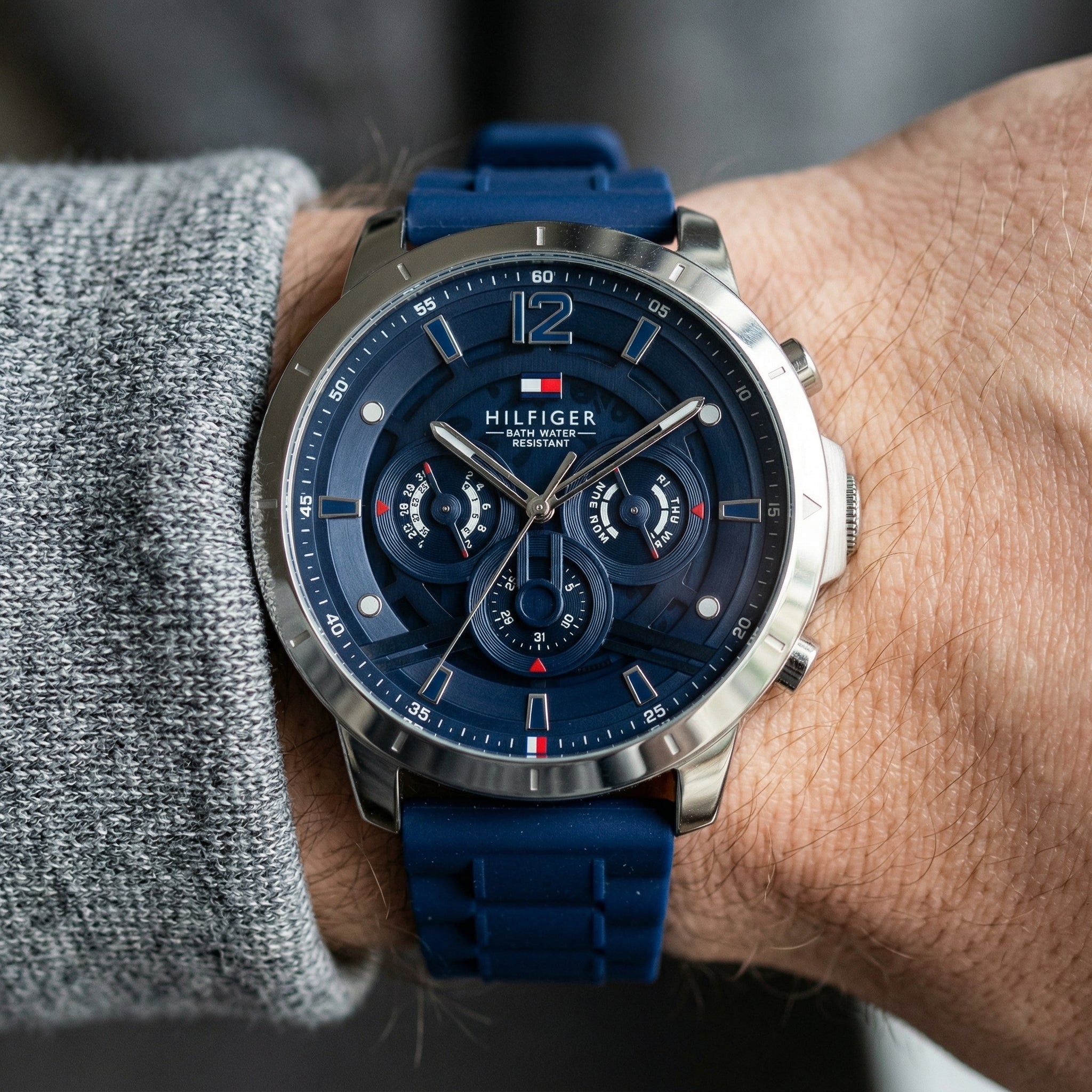 Close up shot of Tommy Hilfiger 1710489 on wrist showing blue dial and multi-function sub-dials