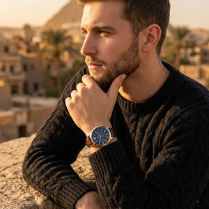 Elegant man wearing Tommy Hilfiger Morrison 1710526 men's quartz battery watch with gold case and luxury brown leather strap