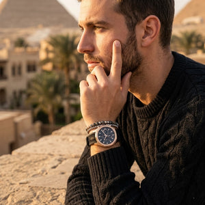 Elegant man wearing Tommy Hilfiger Lars  1710650 men's quartz battery watch with rose gold case and luxury racing rubber strap