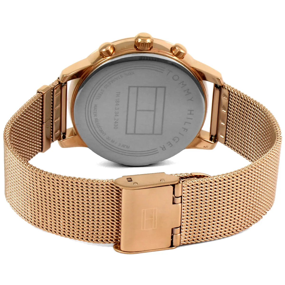 Caseback of Tommy Hilfiger 1781907 women's quartz battery watch showing technical specs rose gold dial and mesh bracelet
