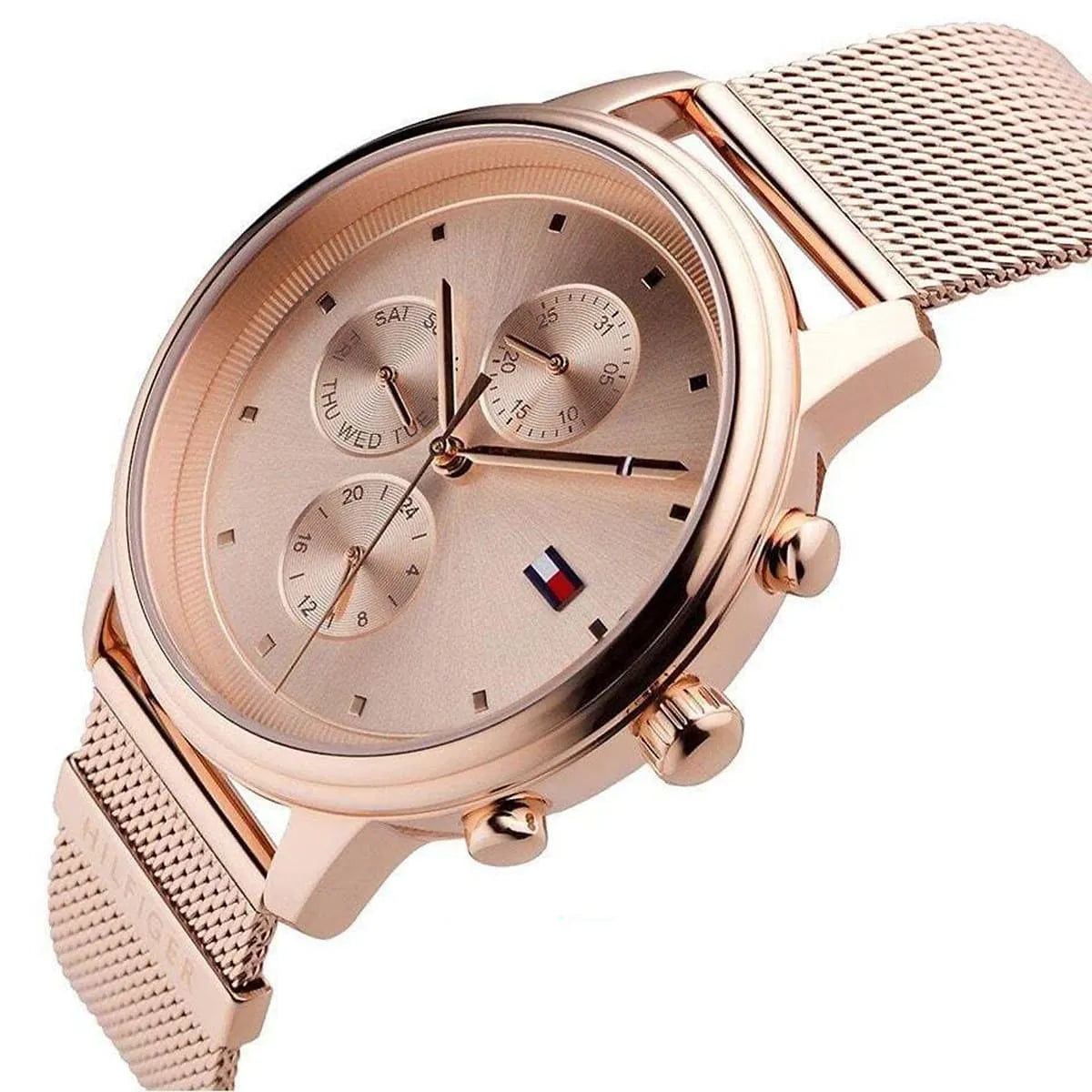 Left angled view of Tommy Hilfiger 1781907 women's quartz battery watch showing rose gold mesh bracelet and slim case profile