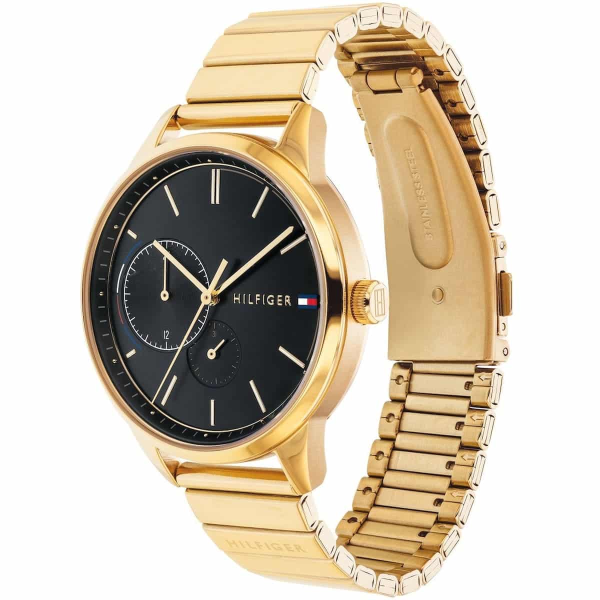 Angled real-life photo of Tommy Hilfiger 1782019 showing the polished gold case and black dial