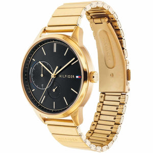 Angled real-life photo of Tommy Hilfiger 1782019 showing the polished gold case and black dial