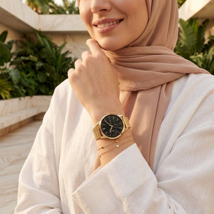 Lifestyle photo of Tommy Hilfiger 1782019 showing the elegant gold watch on a woman's wrist
