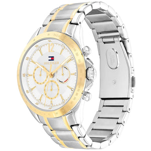 Angled real-life photo of Tommy Hilfiger 1782555 showing the polished gold bezel and silver case