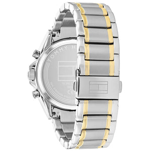 Silver and gold watch with Tommy Hilfiger branding on a white background