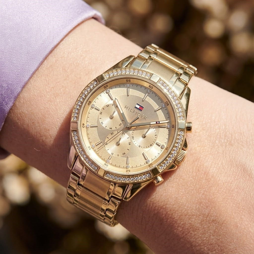Close up shot of Tommy Hilfiger 1782556 on wrist showing sunray gold dial and crystal markers