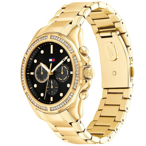 Angled real-life photo of Tommy Hilfiger 1782570 showing the polished gold case and black dial