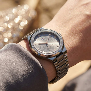 Close up shot of Tommy Hilfiger 1782727 on wrist showing grey sunray dial and rose gold-tone hands