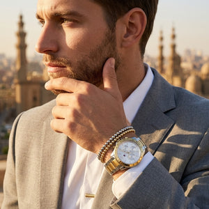 Elegant dynamic man wearing Tommy Hilfiger Hudson Multi-Function Two-Tone (1791226) watch with integrated flexible two-tone silver & gold metal integrated link bracelet adding dynamic casual luxury sports style