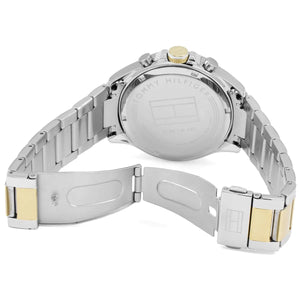 Close-up of a Tommy Hilfiger watch with a metal band on a white background