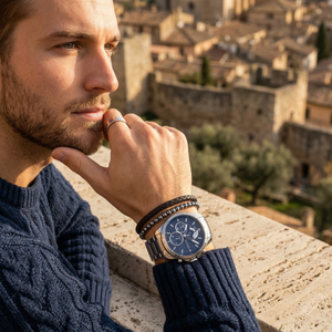 Elegant man wearing Tommy Hilfiger Decker 1791348 men's quartz battery watch with silver-tone case and luxury blue dial