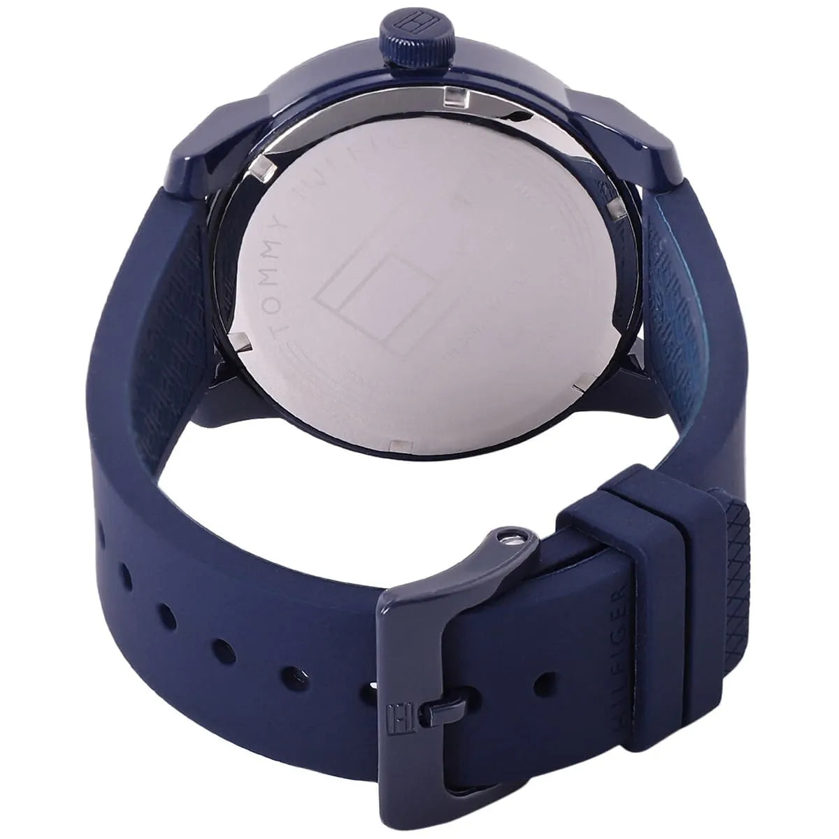 Caseback of Tommy Hilfiger Denim 1791381 men's quartz battery watch showing technical specs blue dial and rubber strap