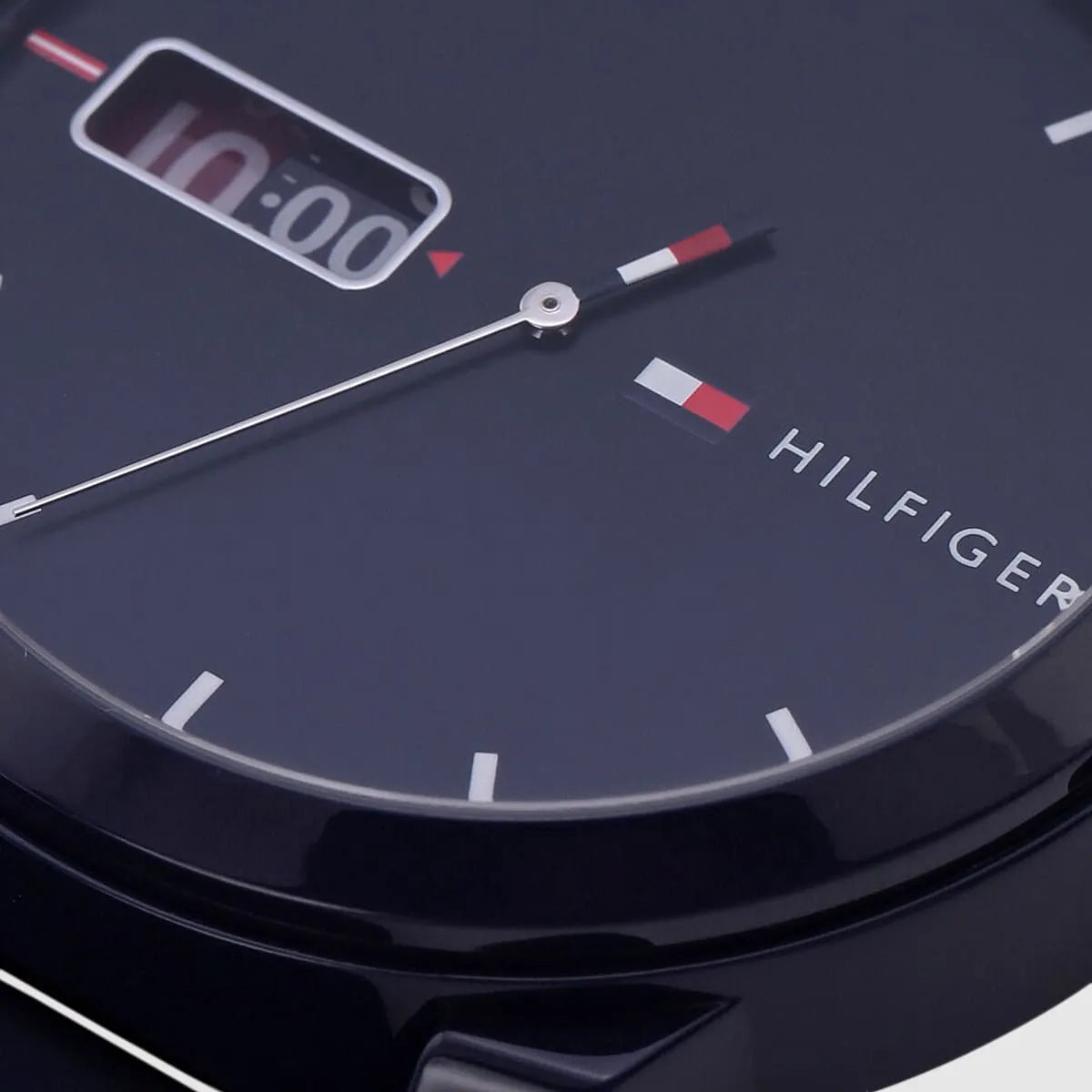 Close-up of a Tommy Hilfiger watch face with digital display.
