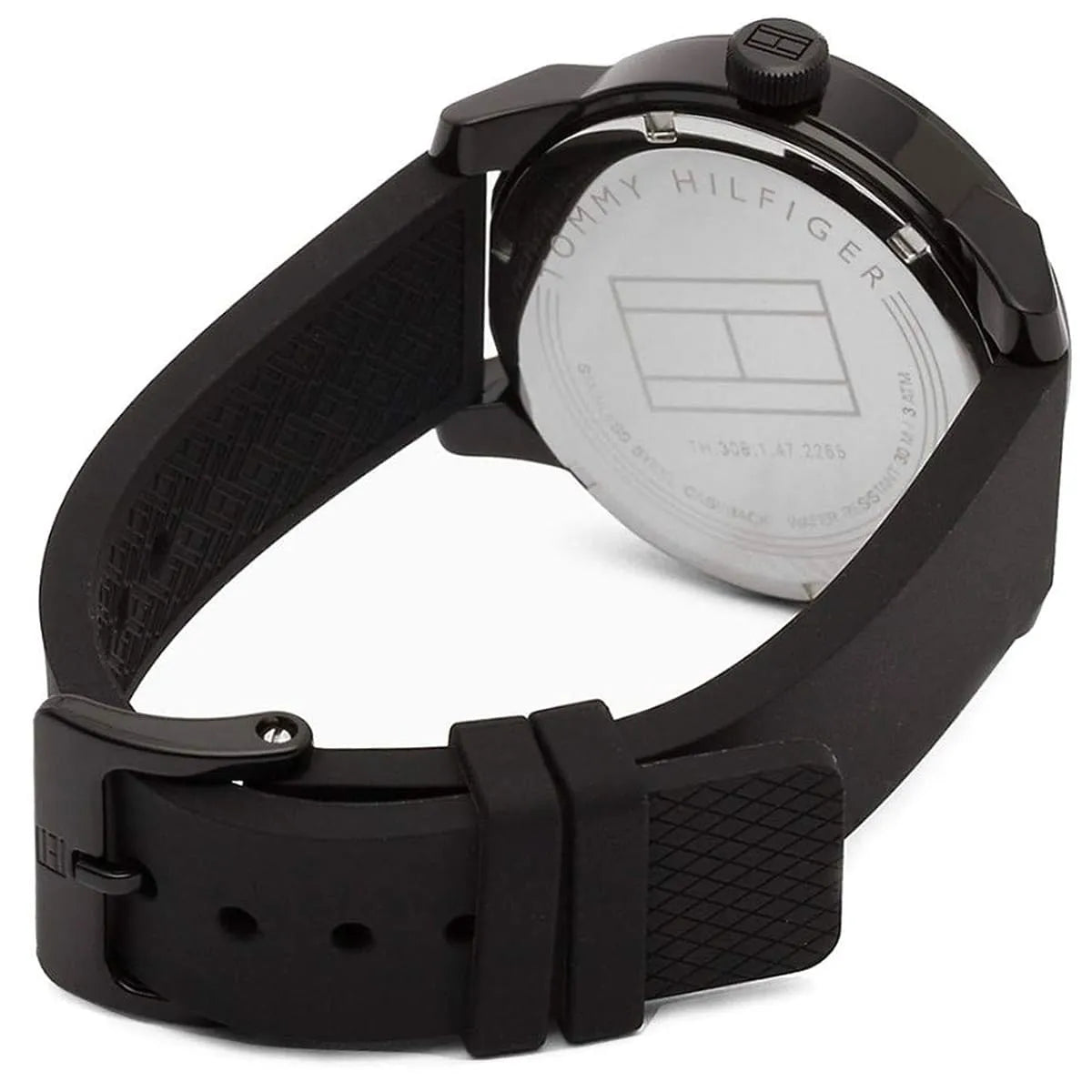 Caseback of Tommy Hilfiger Denim 1791382 men's quartz battery watch showing technical specs black dial and rubber strap