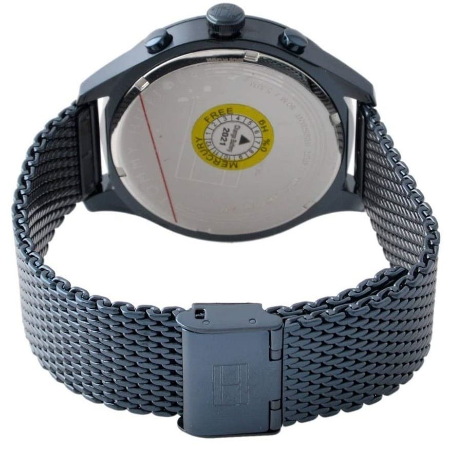 Caseback of Tommy Hilfiger Gavin 1791471 men's quartz battery watch showing technical specs blue dial and mesh bracelet