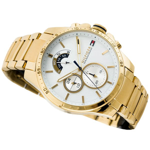 Right angled view of Tommy Hilfiger Decker 1791538 men's quartz battery watch highlighting gold finish and bezel details