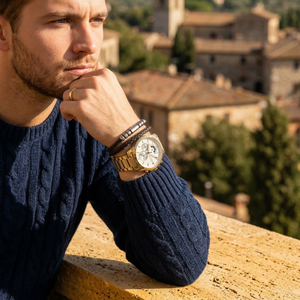 Elegant man wearing Tommy Hilfiger Decker 1791538 men's quartz battery watch with gold-tone case and luxury white dial